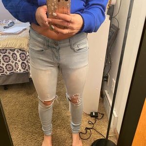 Arizona Light Was Jeans With Rips in Knees